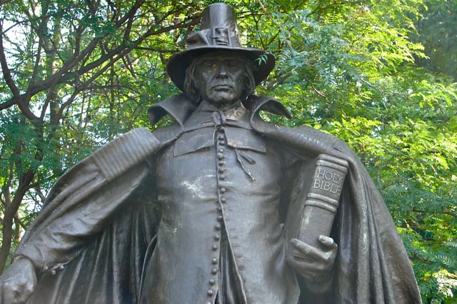 The Pilgrim by Augustus St. Gaudens, 1904. The "buckle hat" atop the sculpture's head, now associated with the Pilgrims in pop culture, was fictional; Pilgrims never wore such an item, nor has any such hat ever existed as a serious piece of apparel.