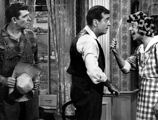 On a 1967 Andy Griffith special, Knotts plays the outraged wife of Tennessee Ernie Ford, as Griffith looks on.