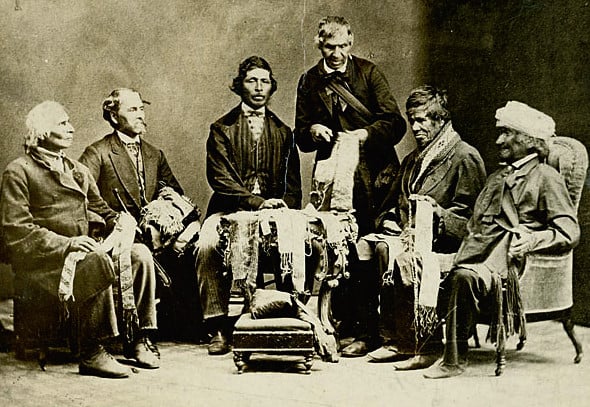 Chiefs of the Six Nations explaining their wampum belts to Horatio Hale, 1871