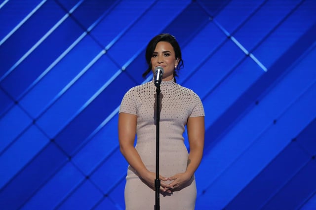 Demi Lovato appeared during the first night of the convention, raising awareness for mental health and delivering a live performance of "Confident".