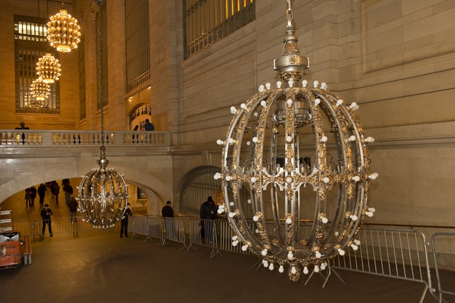 Two of the concourse's ten chandeliers lowered for cleaning, 2013