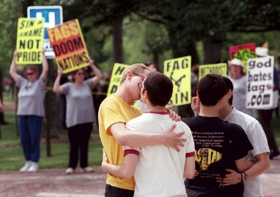 Students kissing in front of protesters from Westboro Baptist Church at Oberlin College in Ohio.