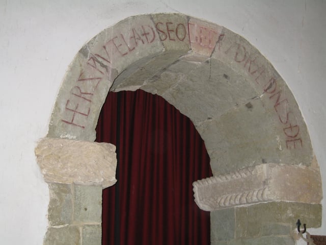 Her sƿutelað seo gecƿydrædnes ðe ('Here is manifested the Word to thee'). Old English inscription over the arch of the south porticus in the 10th-century St Mary's parish church, Breamore, Hampshire