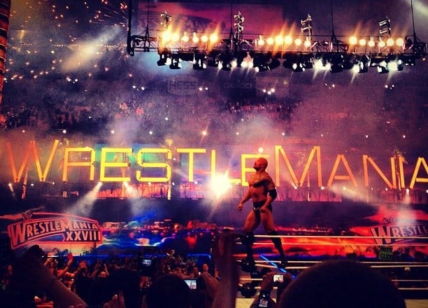 The Rock celebrating his victory at WrestleMania XXVIII in April 2012