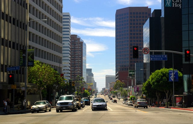 A view of Wilshire Boulevard westbound, toward the ocean. Brentwood begins on the right-hand side of the street.