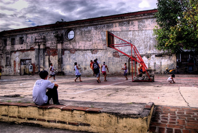 Children playing basketball at the ruins of San Ignacio Church in Intramuros