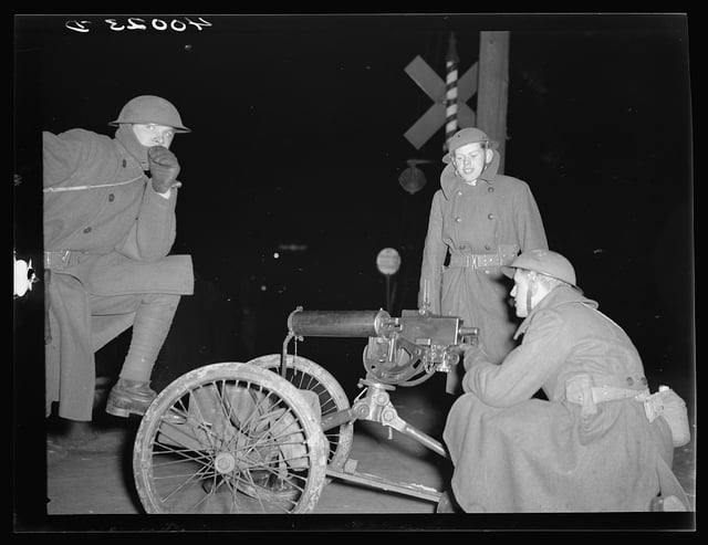 National Guardsmen with machine guns overlooking Chevrolet factories number nine and number four