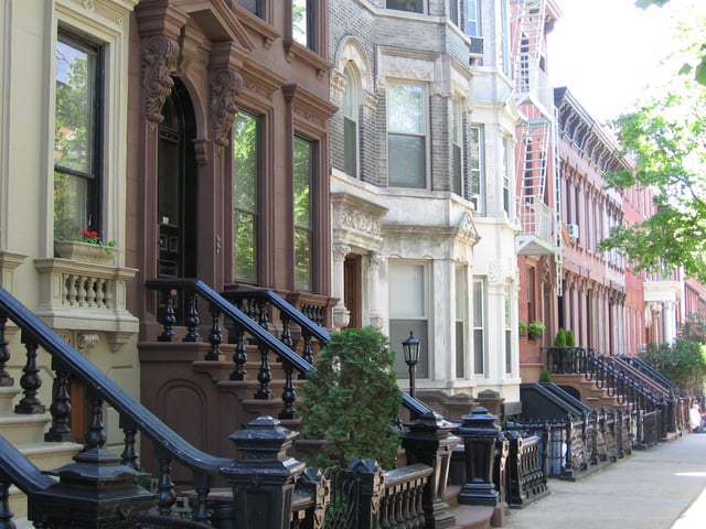 Landmark 19th-century rowhouses on tree-lined Kent Street in Greenpoint Historic District