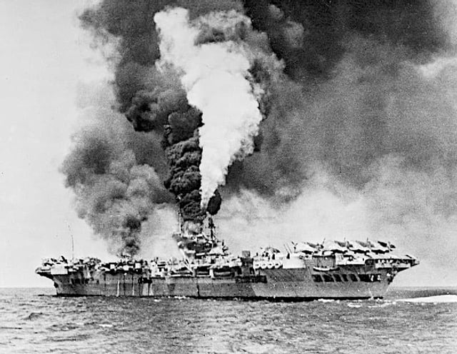 HMS Formidable on fire after a kamikaze attack on May 4. The ship was out of action for fifty minutes.