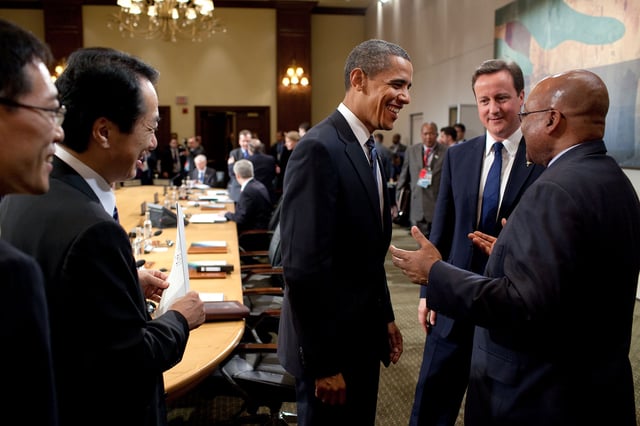 Obama, Cameron, and Zuma talking at the African Outreach session.