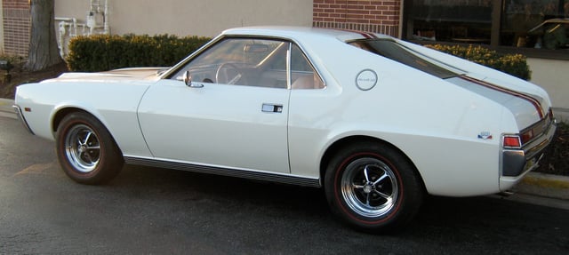 1968 AMC AMX with chrome wheels and red stripe tires standard with Go-Package