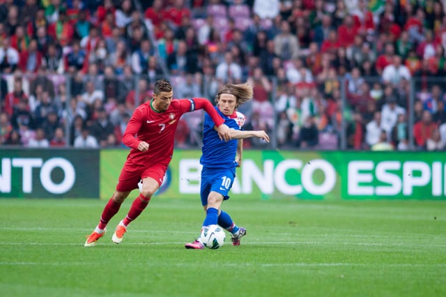 Ronaldo evades club teammate Luka Modrić during a friendly match against Croatia in June 2013