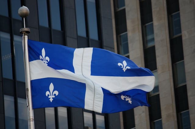 The Fleurdelisé flying at Place d'Armes in Montreal