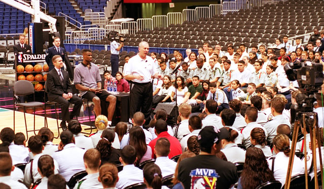 Popovich with Secretary of Defense William Cohen and Spurs' player David Robinson speaks at Junior ROTC cadets from local high schools.
