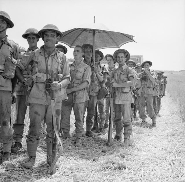 Men of the 6th Battalion, Royal Inniskilling Fusiliers, British 78th Division, await orders to move into Centuripe, Sicily, 2 August 1943.