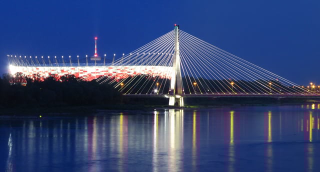 Night view of the National Stadium and the Świętokrzyski Bridge from the left bank of the Vistula