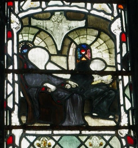 Stained glass at Gloucester Cathedral depicting Bede dictating to a scribe