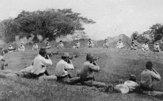 Japanese soldiers shooting blindfolded Sikh prisoners