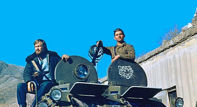 KGB special operative Igor Morozov sits on top of the BTR-60 armoured vehicle during his assignment to the Badakhshan province, c. 1982