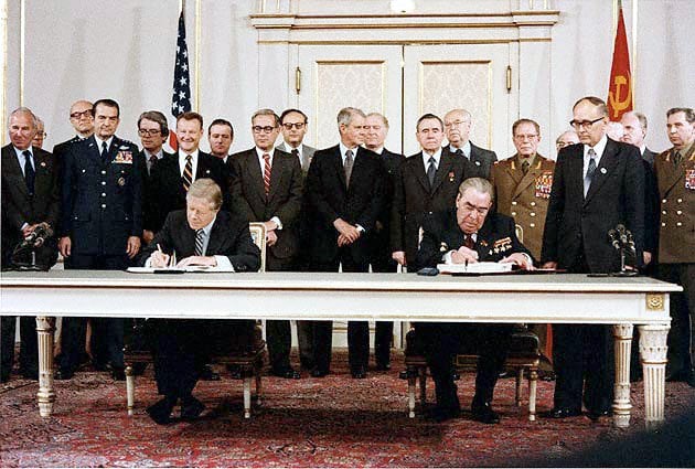 Soviet General Secretary Leonid Brezhnev and US President Jimmy Carter sign the SALT II arms limitation treaty in Vienna on 18 June 1979