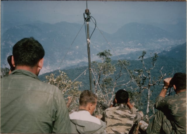 U.S. soldiers directing artillery on enemy trucks in A Shau Valley, April 1968