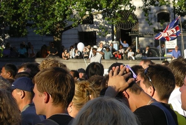 People observing a two-minute silence in Trafalgar Square on the evening of 14 July 2005