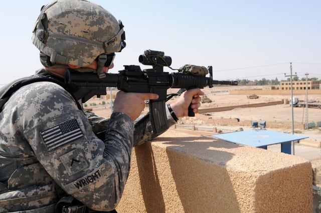 U.S. Army soldier on the roof of an Iraqi police station in Haqlaniyah, July 2011