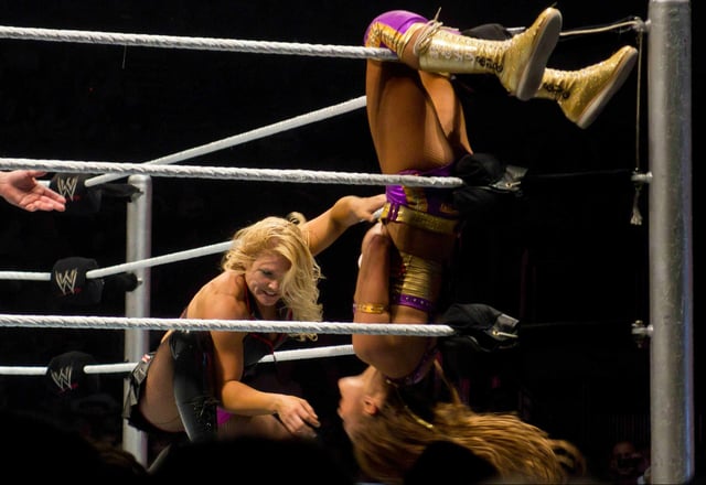 Phoenix wrestling Eve during a WWE house show in November 2011