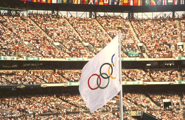 The Olympic flag waves at the 1996 games.