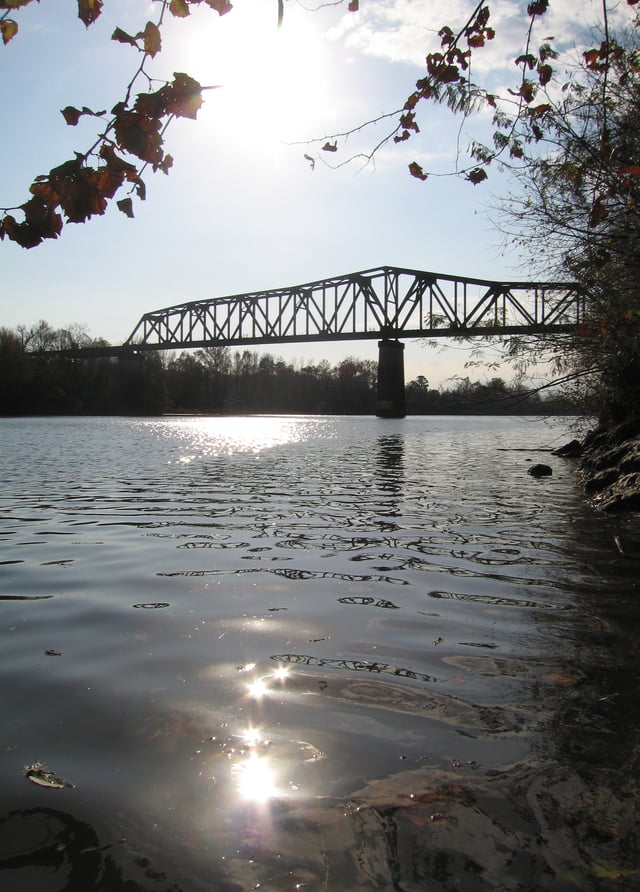 The Black Warrior River as it flows through town. M&O Railroad Trestle Bridge in the background.