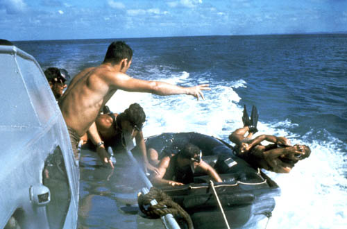 UDT members using the casting technique from a speeding boat