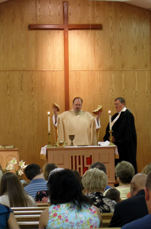 An Elder presides over Holy Communion