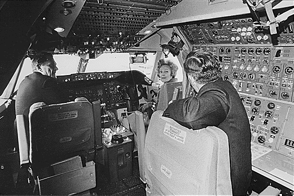 First Lady Pat Nixon ushered in the era of jumbo jets by christening the first commercial 747 at a ceremony at Dulles International Airport on January 15, 1970 (top); the First Lady then climbed aboard and visited the cockpit (below).