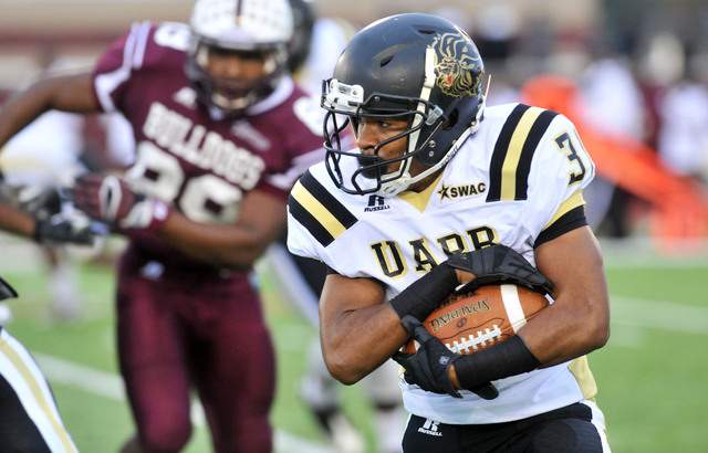 A UAPB player running the ball in 2014