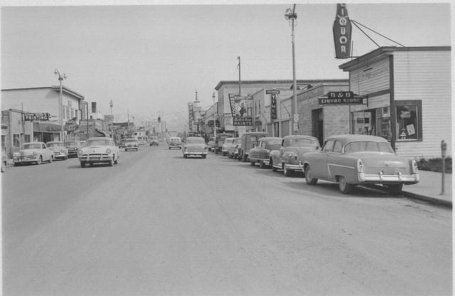 Fourth Avenue in 1953, looking east from near I Street. Just ten years before, the retail area shown in the foreground was mostly an industrial area, housing lumber yards and similar uses.