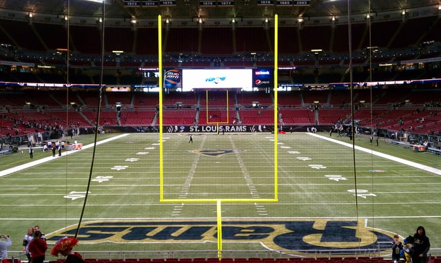 A football field as seen from behind one end zone.