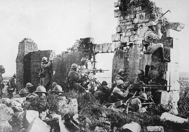 French soldiers under General Gouraud, with machine guns amongst the ruins of a cathedral near the Marne, 1918