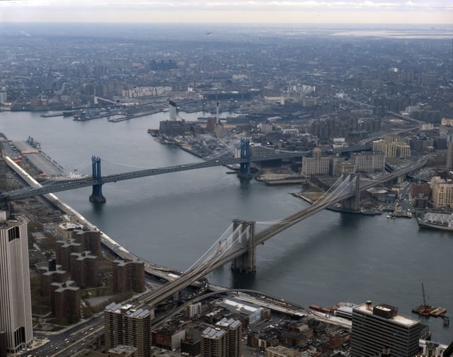 The Brooklyn Bridge in the foreground and the Manhattan Bridge beyond it, are two of the three bridges that connect Lower Manhattan with Brooklyn over the East River.