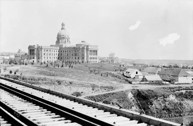The completed Alberta Legislature Building in 1914, just above the last Fort Edmonton. The city was selected as Alberta's capital in 1905.