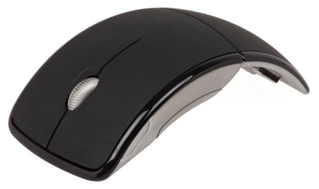 A Microsoft wireless Arc Mouse, marketed as "travel-friendly" and foldable but otherwise operated exactly like other 3-button wheel-based optical mice