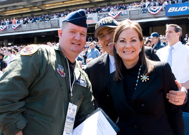 A New York Air National Guard major poses with Rudy and Judith Giuliani at Yankee Stadium in April 2009