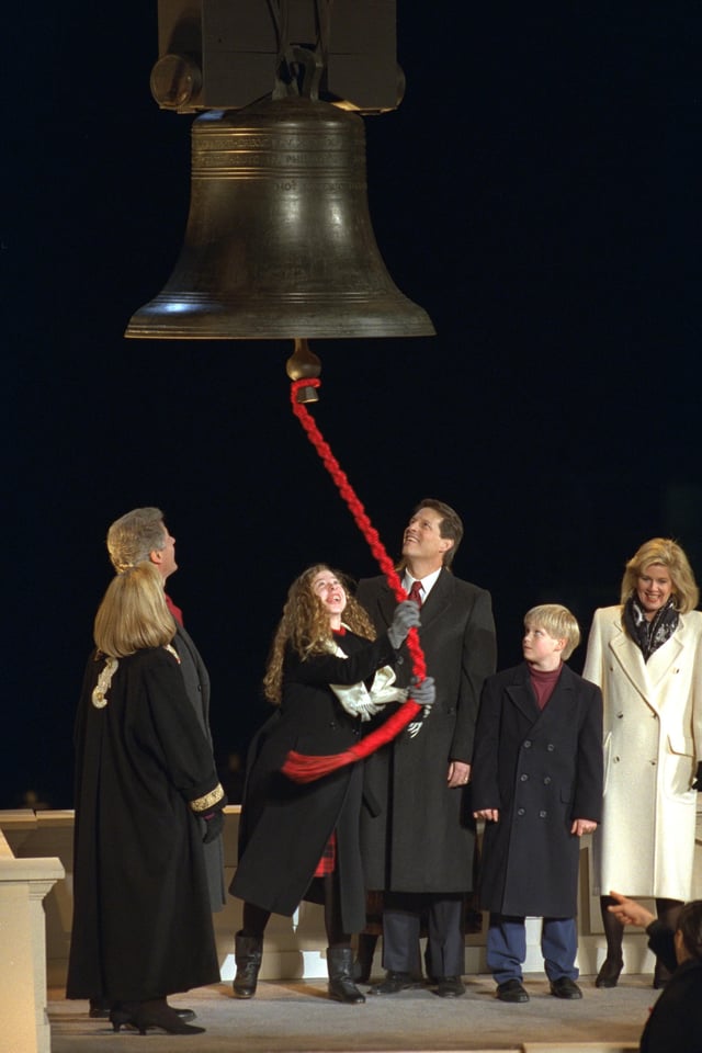 Clinton ringing a replica of the Liberty Bell at her father's first inauguration