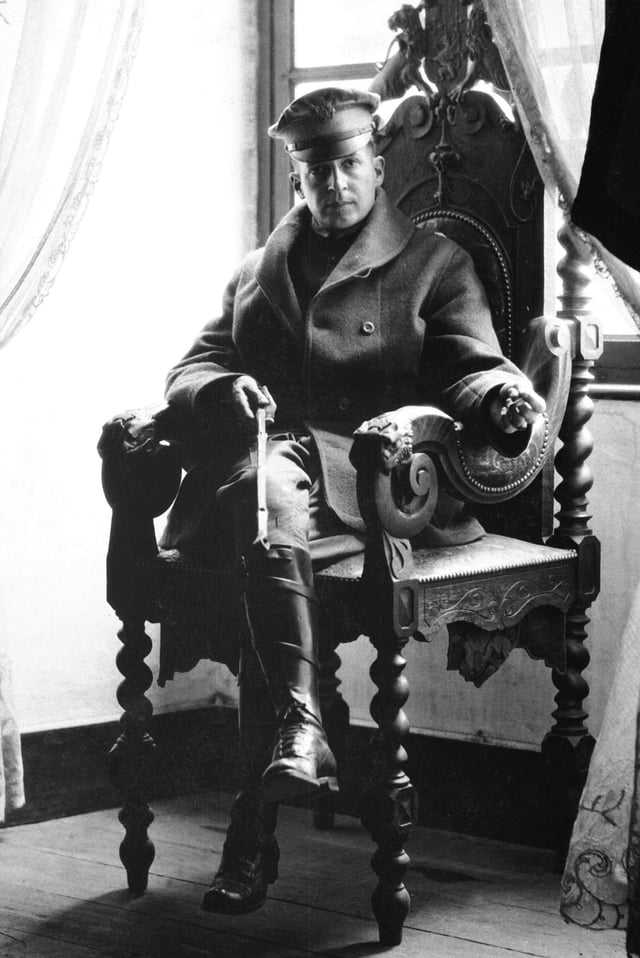Brigadier General MacArthur holding a riding crop at a French château, September 1918