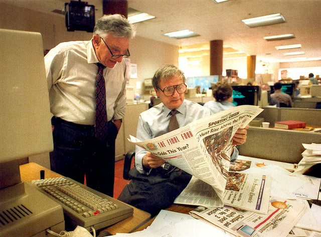 Bill German (left), the Chronicle's editor emeritus, and page-one editor Jack Breibart in the newsroom, March 1994