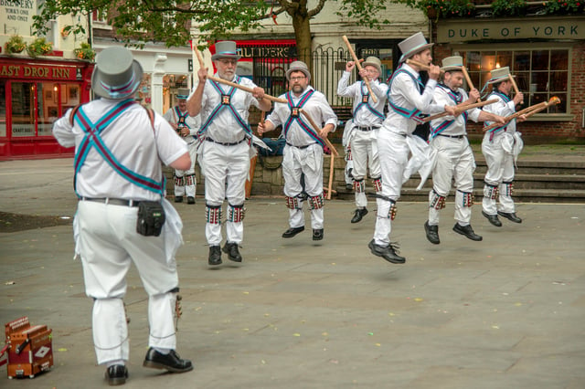 Morris dancers entertain tourists in King's Square near The Shambles