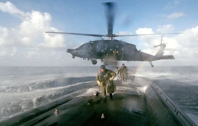 MH-60L from 160th SOAR deploys an ODA from 7th SFG(A) onboard a U.S. submarine for a joint exercise