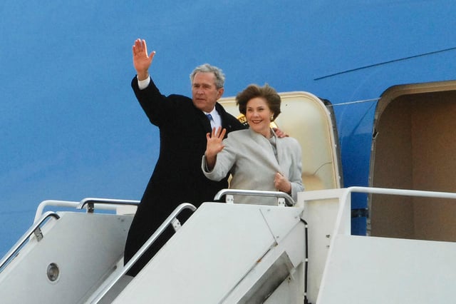 George and Laura Bush waving to a crowd of 1000 at Andrews Air Force Base before their final departure to Texas, January 20, 2009