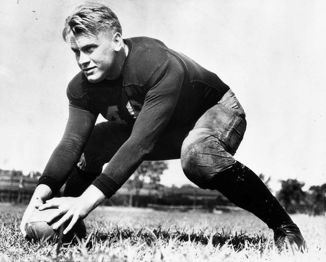 Ford during practice as a center on the University of Michigan football team, 1933