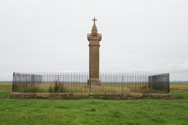 The 19th century memorial to Edward I at Burgh Marsh. This structure replaced an earlier one and is said to mark the exact spot where he died.