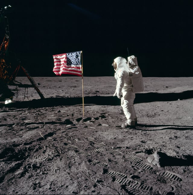Astronaut Buzz Aldrin salutes the United States flag on the surface of the moon during the Apollo 11 mission.